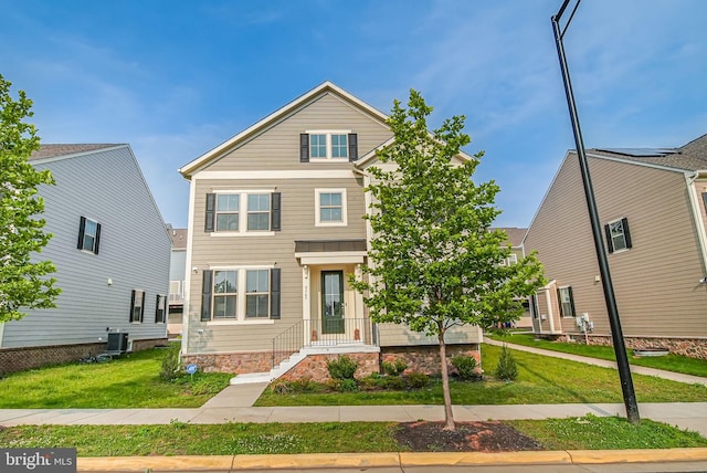9563 Jefferson St, Manassas, VA 20110 - view of front facade with central AC unit and a front yard