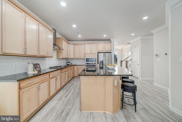 9563 Jefferson St, Manassas, VA 20110 - kitchen with light brown cabinetry, stainless steel appliances, baseboards, crown molding, and recessed lighting
