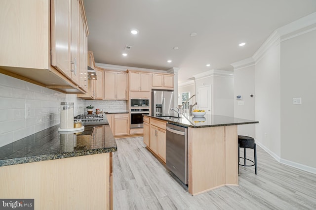 9563 Jefferson St, Manassas, VA 20110 - kitchen featuring stainless steel appliances, light brown cabinets, light wood-style flooring, crown molding, and a sink