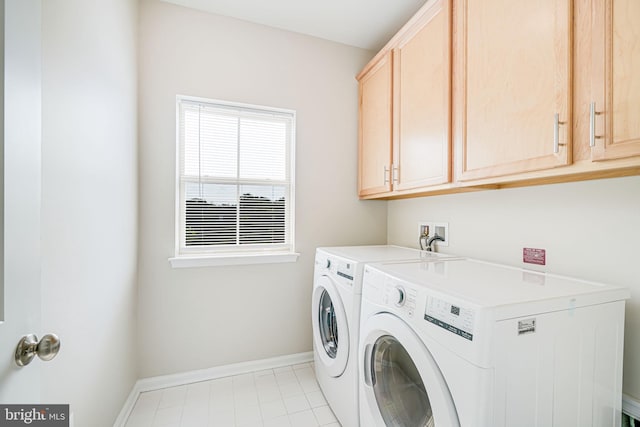 9563 Jefferson St, Manassas, VA 20110 - laundry area with separate washer and dryer, cabinet space, baseboards, and light tile patterned floors