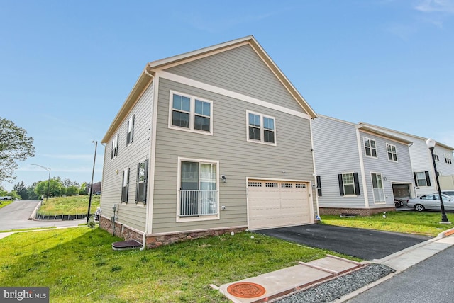 9563 Jefferson St, Manassas, VA 20110 - view of front of property with an attached garage, asphalt driveway, and a front lawn