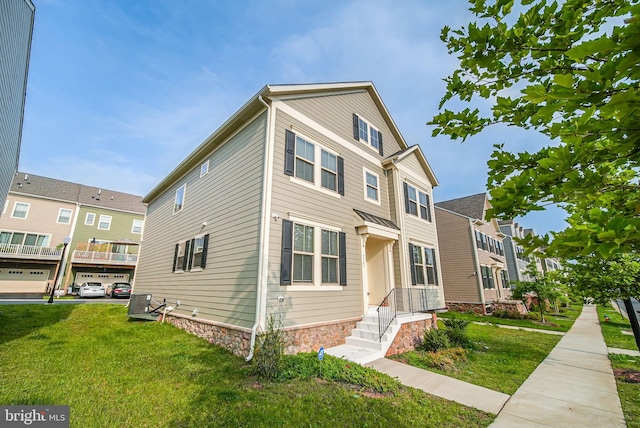 9563 Jefferson St, Manassas, VA 20110 - multi unit property featuring a front yard and stone siding