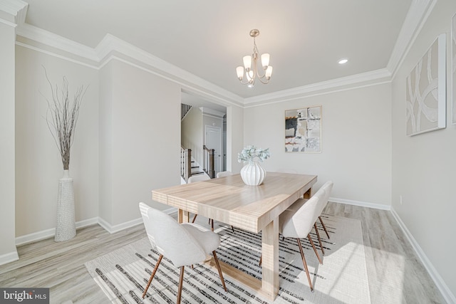 9563 Jefferson St, Manassas, VA 20110 - dining space featuring wood finished floors, a chandelier, baseboards, recessed lighting, and stairs