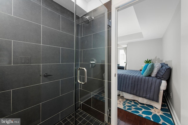 1204 S 12th St Unit O, Philadelphia, PA 19147 - bathroom with a stall shower, ensuite bath, wood finished floors, and baseboards