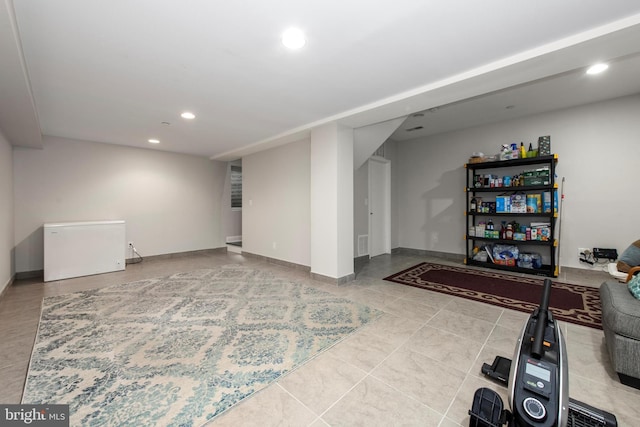 1204 S 12th St Unit O, Philadelphia, PA 19147 - finished below grade area with recessed lighting, baseboards, refrigerator, and tile patterned floors