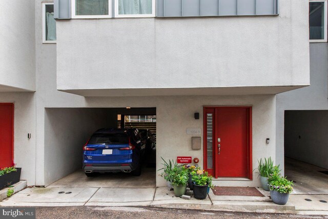 1204 S 12th St Unit O, Philadelphia, PA 19147 - view of exterior entry featuring stucco siding and a carport