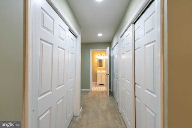 230 N Port St, Baltimore, MD 21224 - hall featuring light colored carpet, baseboards, and recessed lighting