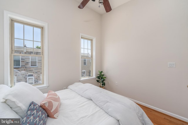 230 N Port St, Baltimore, MD 21224 - bedroom with wood finished floors, baseboards, and ceiling fan