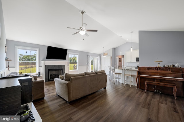215 Naples Way, Charles Town, WV 25414 - living room with vaulted ceiling, ceiling fan, dark wood finished floors, and a fireplace