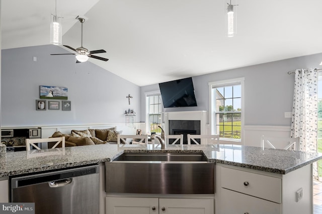 215 Naples Way, Charles Town, WV 25414 - kitchen with dishwasher, open floor plan, lofted ceiling, white cabinetry, and a fireplace