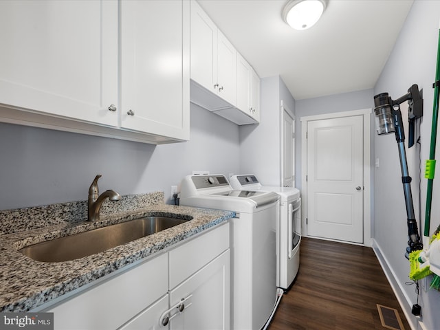 215 Naples Way, Charles Town, WV 25414 - laundry area with washer and dryer, dark wood finished floors, and cabinet space