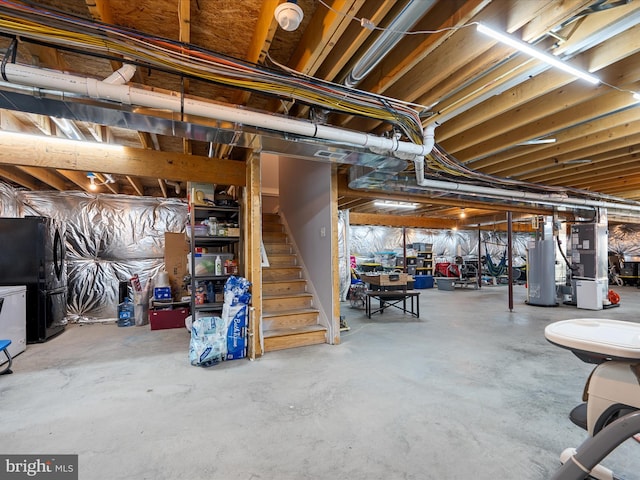 215 Naples Way, Charles Town, WV 25414 - unfinished below grade area featuring gas water heater, heating unit, freestanding refrigerator, and stairway