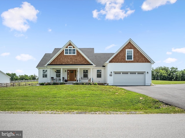 215 Naples Way, Charles Town, WV 25414 - view of front of home featuring driveway, covered porch, board and batten siding, and a garage