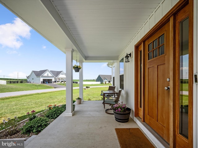 215 Naples Way, Charles Town, WV 25414 - covered porch featuring a yard