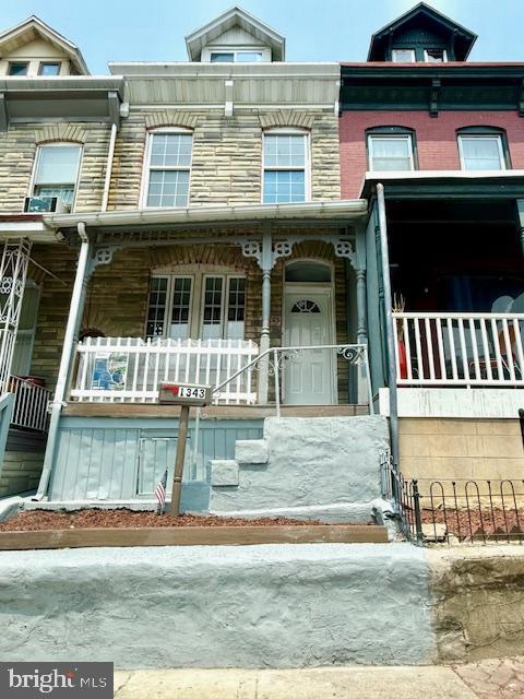 1343 Muhlenberg St, Reading, PA 19602 - view of property with a porch and stone siding