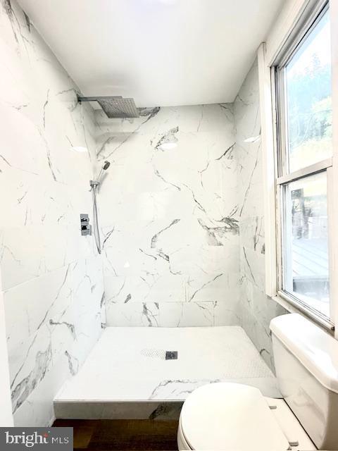 1343 Muhlenberg St, Reading, PA 19602 - full bathroom featuring toilet, healthy amount of natural light, and a marble finish shower