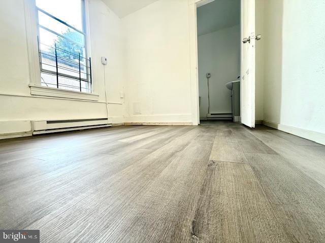 1343 Muhlenberg St, Reading, PA 19602 - empty room featuring a baseboard radiator