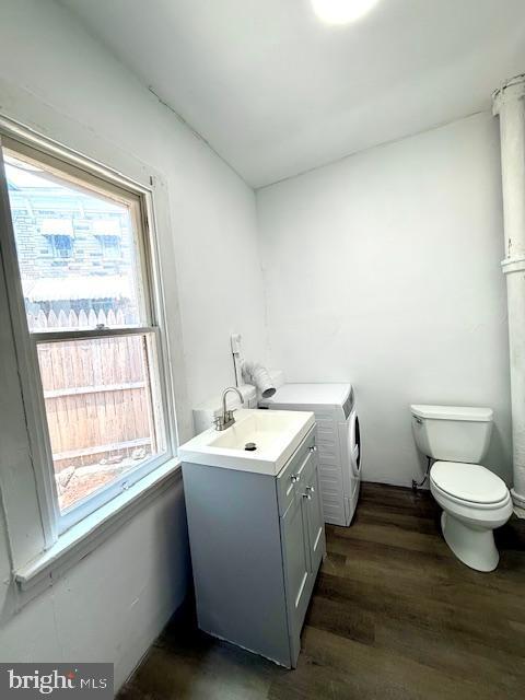 1343 Muhlenberg St, Reading, PA 19602 - washroom featuring healthy amount of natural light, dark wood finished floors, and washer / dryer