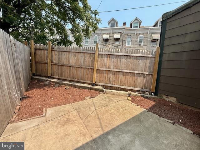 1343 Muhlenberg St, Reading, PA 19602 - fenced backyard featuring a patio area