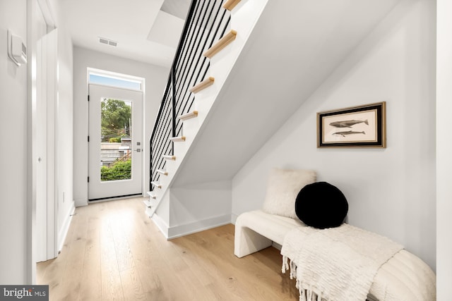 2647 41st St NW Unit 3, Washington, DC 20007 - foyer entrance featuring light wood-style flooring, stairs, and baseboards