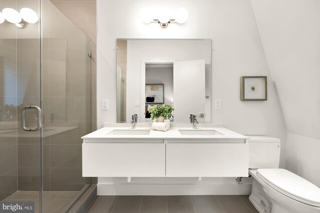 2647 41st St NW Unit 3, Washington, DC 20007 - bathroom with toilet, double vanity, a stall shower, and tile patterned floors