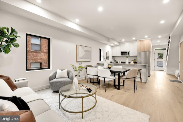 2647 41st St NW Unit 3, Washington, DC 20007 - living room with recessed lighting, baseboards, and light wood-style floors