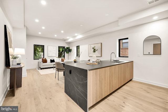 2647 41st St NW Unit 3, Washington, DC 20007 - kitchen with modern cabinets, a sink, light brown cabinetry, light wood-style floors, and recessed lighting