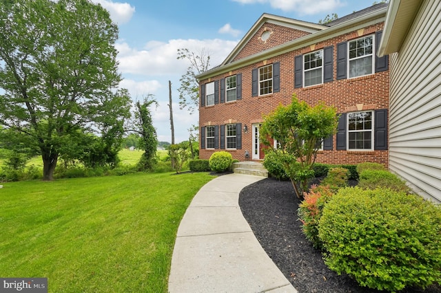 2425 Ellies Way W, Friendship, MD 21794 - colonial home with brick siding and a front lawn