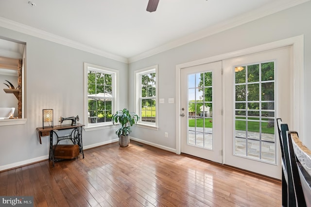 2425 Ellies Way W, Friendship, MD 21794 - doorway to outside featuring crown molding, plenty of natural light, hardwood / wood-style floors, ceiling fan, and baseboards