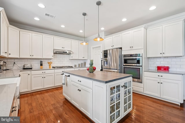 2425 Ellies Way W, Friendship, MD 21794 - kitchen with stainless steel appliances, decorative backsplash, white cabinetry, and recessed lighting