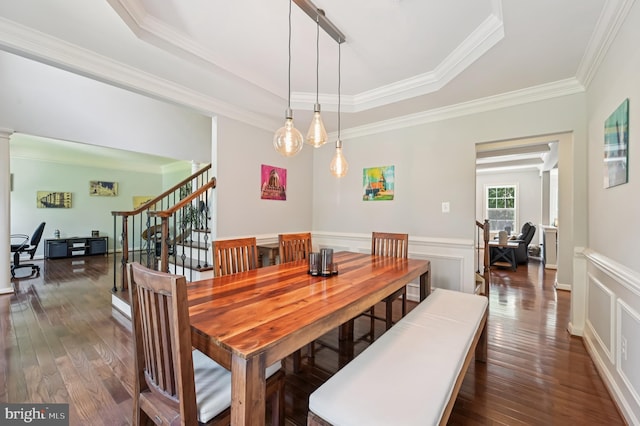 2425 Ellies Way W, Friendship, MD 21794 - dining area with a raised ceiling, dark wood-style floors, crown molding, stairs, and wainscoting