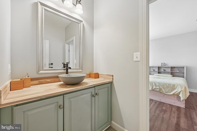 2425 Ellies Way W, Friendship, MD 21794 - bathroom with vanity, wood finished floors, and baseboards