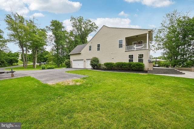 2425 Ellies Way W, Friendship, MD 21794 - view of side of property featuring a balcony, a lawn, and driveway