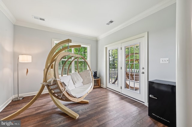 2425 Ellies Way W, Friendship, MD 21794 - living area with dark wood-type flooring, plenty of natural light, crown molding, and baseboards