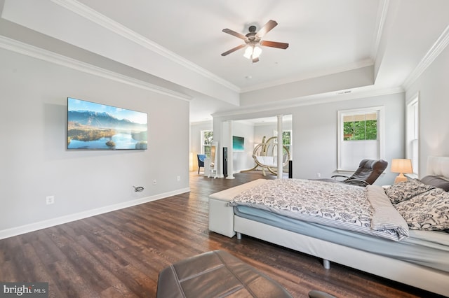 2425 Ellies Way W, Friendship, MD 21794 - bedroom featuring dark wood finished floors, ornamental molding, a tray ceiling, and baseboards