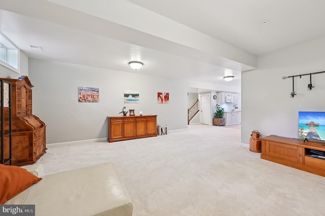 2425 Ellies Way W, Friendship, MD 21794 - living area with carpet flooring, stairway, and baseboards