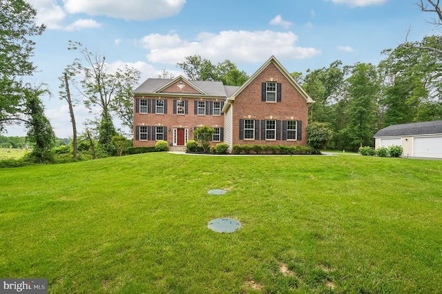 2425 Ellies Way W, Friendship, MD 21794 - view of front facade featuring brick siding, a garage, and a front lawn