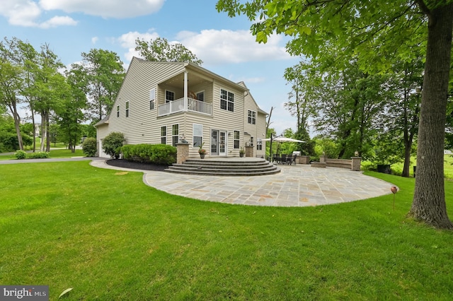 2425 Ellies Way W, Friendship, MD 21794 - back of property featuring a balcony, a patio area, a lawn, and french doors
