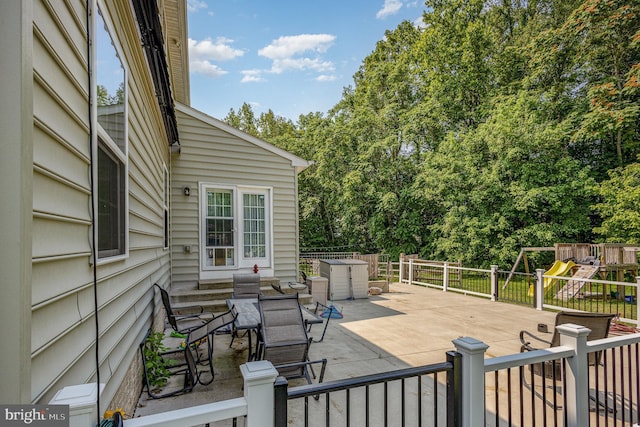 5150 Spinnaker Ln, King George, VA 22485 - deck featuring a patio area and a playground