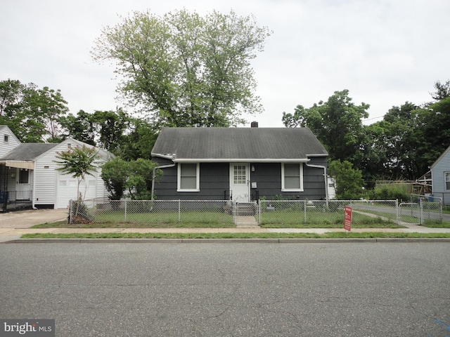 928 Linden, Pleasantville, NJ 08232 - view of front of home with a fenced front yard, a garage, and concrete driveway