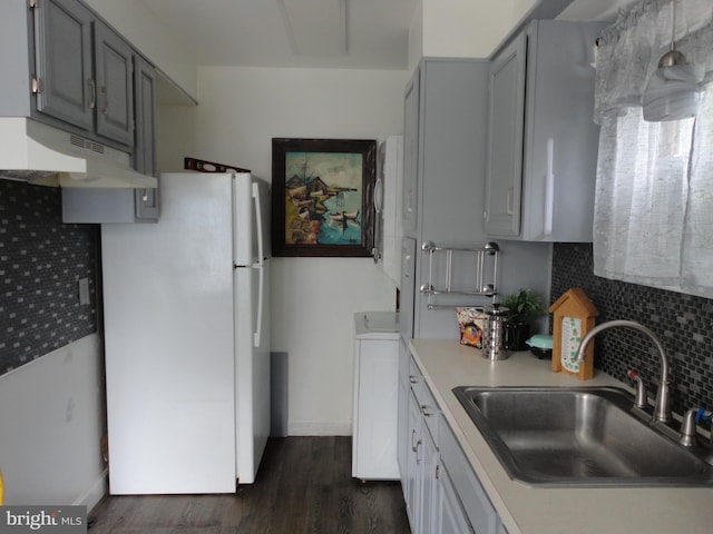 928 Linden, Pleasantville, NJ 08232 - kitchen with a sink, under cabinet range hood, gray cabinets, freestanding refrigerator, and light countertops