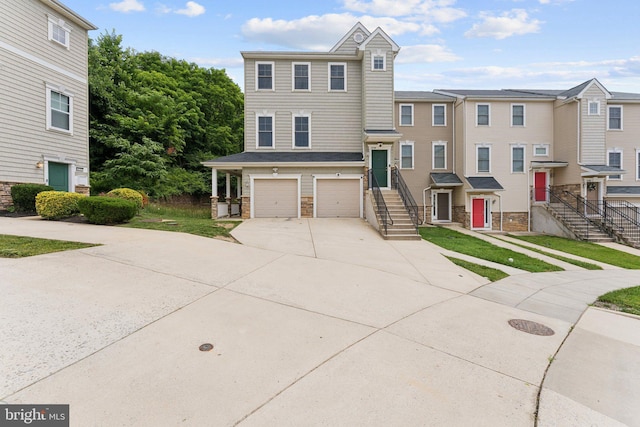 412 Woodcrest Dr SE Unit 412B, Washington, DC 20032 - multi unit property with driveway, an attached garage, stone siding, and a front yard