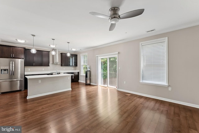 412 Woodcrest Dr SE Unit 412B, Washington, DC 20032 - kitchen with stainless steel refrigerator with ice dispenser, a sink, light countertops, crown molding, and a center island with sink