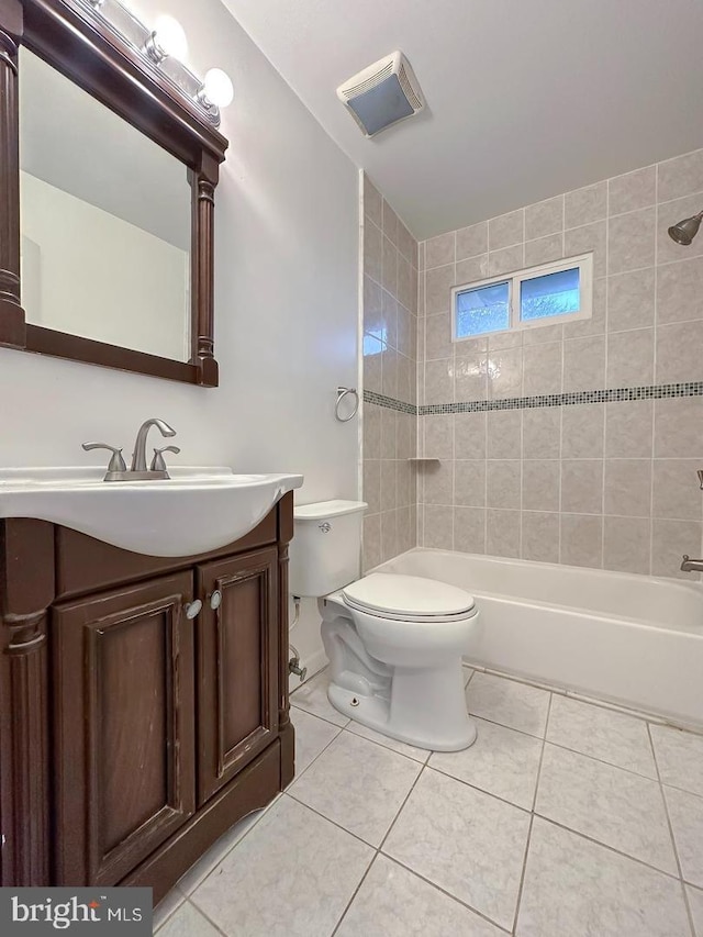 8432 Ravenswood Rd, New Carrollton, MD 20784 - bathroom with vanity, tile patterned floors, toilet, and shower / washtub combination