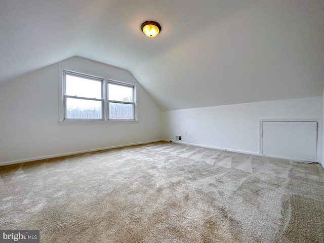 8432 Ravenswood Rd, New Carrollton, MD 20784 - bonus room featuring carpet flooring, vaulted ceiling, and baseboards
