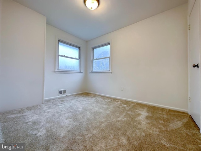 8432 Ravenswood Rd, New Carrollton, MD 20784 - spare room with carpet flooring and baseboards