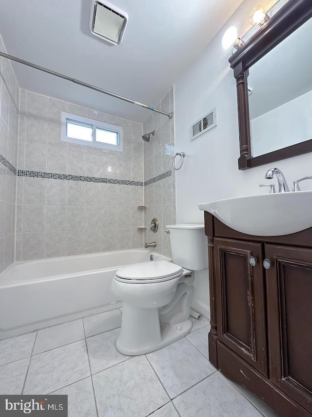 8432 Ravenswood Rd, New Carrollton, MD 20784 - full bathroom featuring bathtub / shower combination, toilet, tile patterned flooring, and vanity