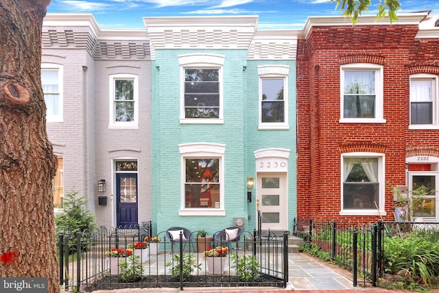 2230 12th St NW, Washington, DC 20009 - multi unit property with brick siding and a fenced front yard