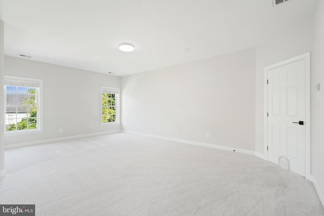 6513 Debhill Ln, Gainesville, VA 20155 - spare room with light colored carpet, baseboards, and healthy amount of natural light
