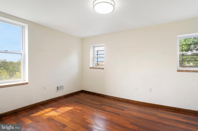 2400 Druid Hill Ave, Baltimore, MD 21217 - unfurnished room with dark wood finished floors and baseboards
